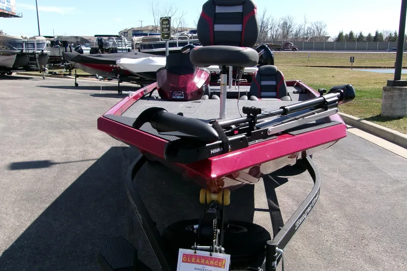 Slide: The Image of 2024 Ranger RT188 boat in a parking lot, featuring a sleek red design and modern seating. - 3