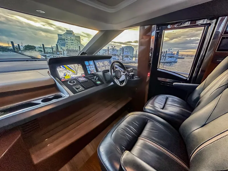 Slide: The Image of Luxurious Princess 78 yacht cockpit with leather seats and advanced navigation system, 2020 model. - 14