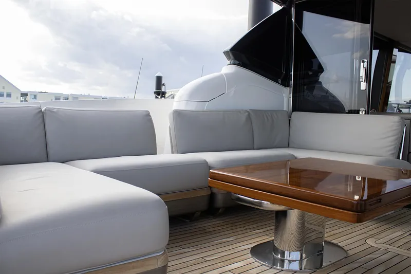 Slide: The Image of Luxurious seating area on 2020 Princess 78 yacht with wooden table. - 18