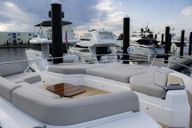 Slide: The Image of Luxury Princess 78 yacht, 2020 model, docked with elegant seating area. - 21