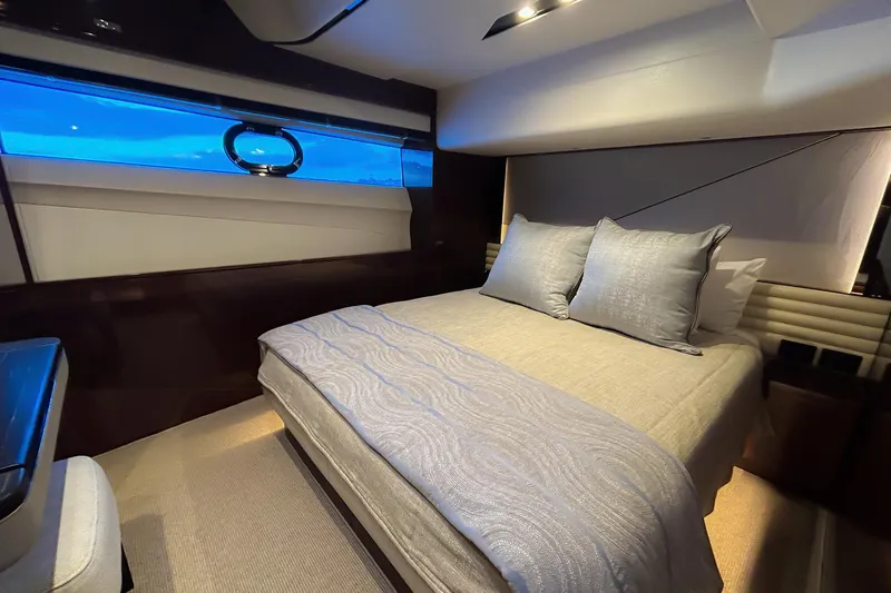 Slide: The Image of Luxurious bedroom interior of 2020 Princess 78 yacht with elegant bedding and ambient lighting. - 5