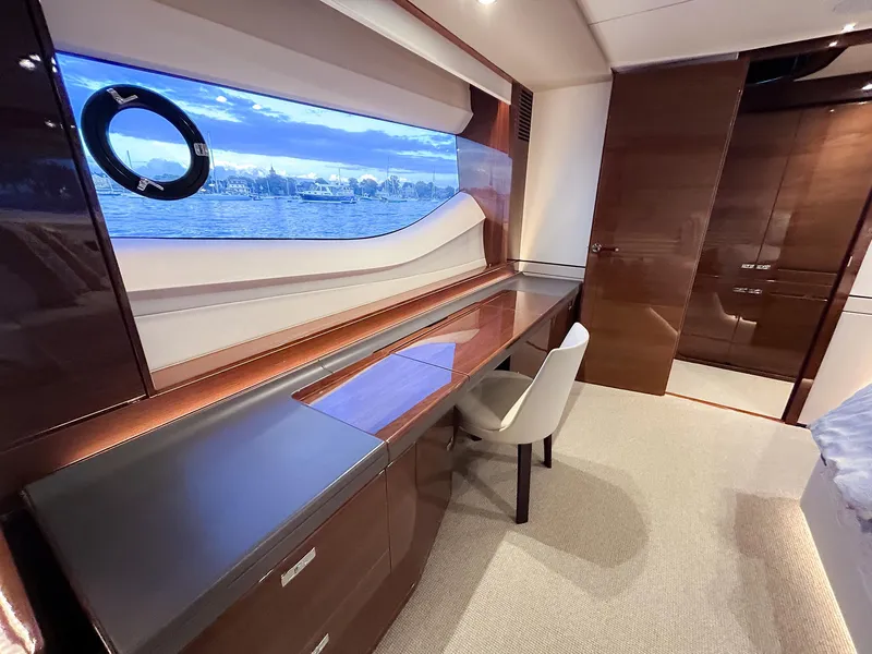 Slide: The Image of Luxurious yacht interior with desk, chair, and large window view, Princess 78 model, 2020. - 7