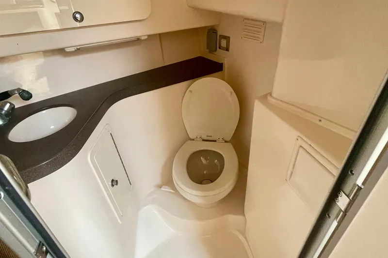 Slide: The Image of 2009 Grady-White 330 Explorer boat bathroom with sink and toilet. - 11