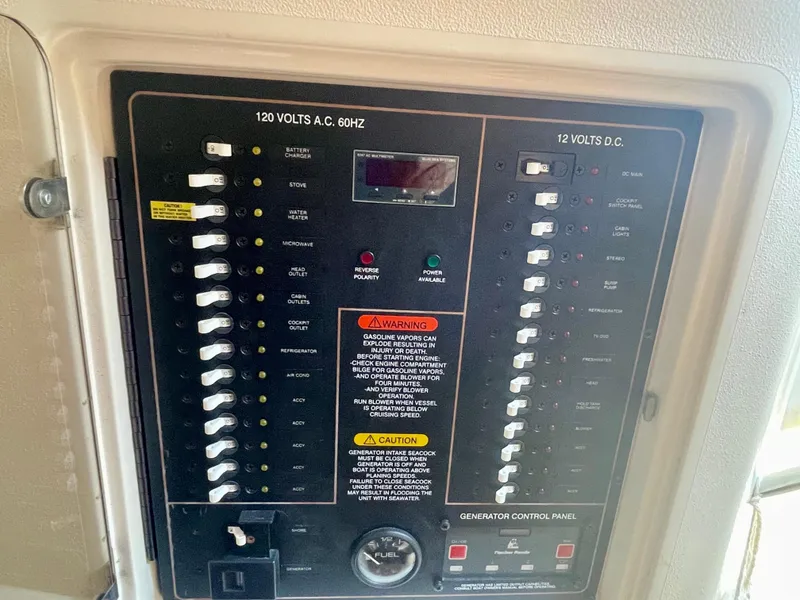 Slide: The Image of Electrical control panel on a 2009 Grady-White 330 Explorer boat. - 12
