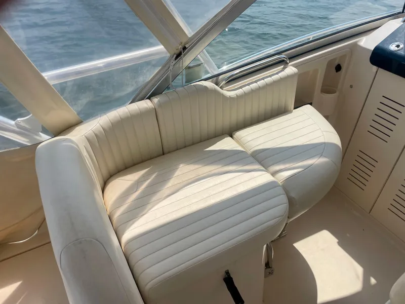 Slide: The Image of 2009 Grady-White 330 Explorer boat interior with white seating. - 3