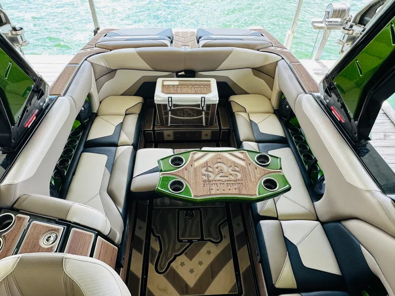 Slide: The Image of Luxurious interior of 2021 Centurion Ri245 boat with stylish seating and table. - 26