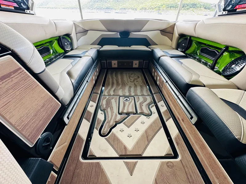 Slide: The Image of Luxurious interior of 2021 Centurion Ri245 boat with stylish seating and wood accents. - 30