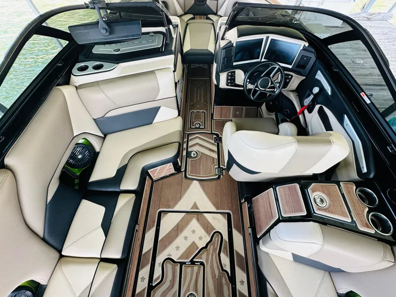 Slide: The Image of Luxurious interior of 2021 Centurion Ri245 boat with modern dashboard and seating. - 31