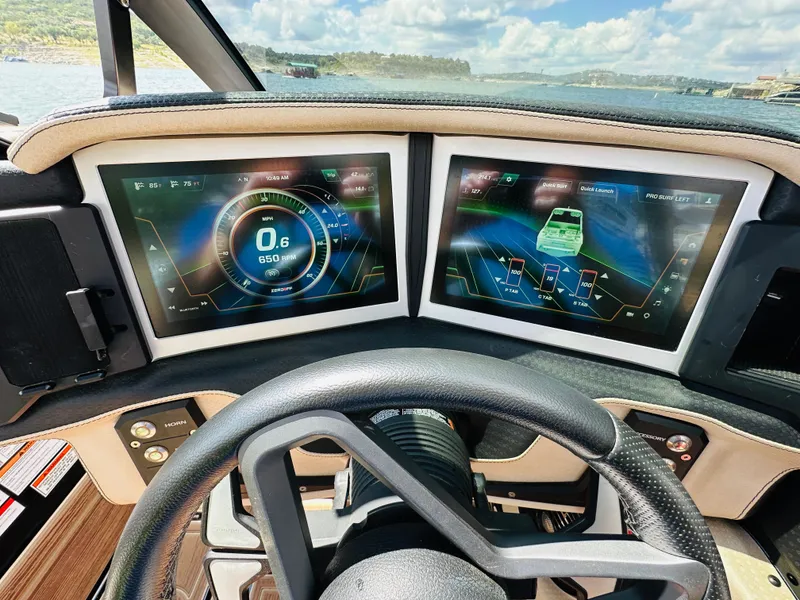 Slide: The Image of 2021 Centurion Ri245 dashboard with dual digital displays and steering wheel. - 33