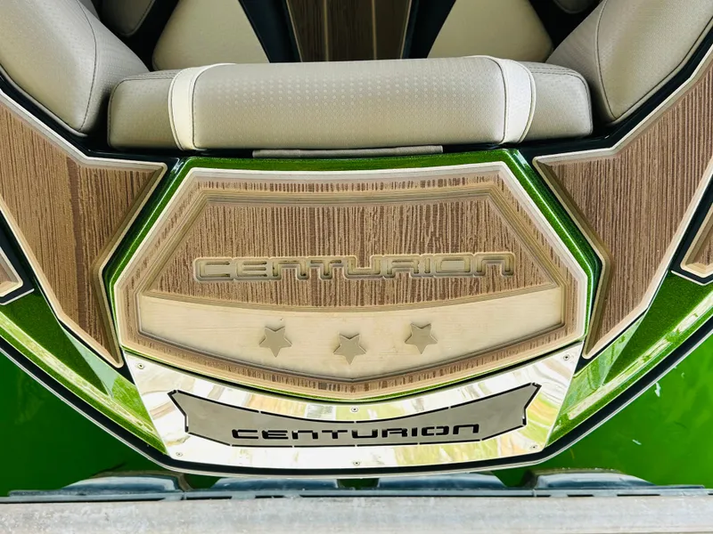 Slide: The Image of 2021 Centurion Ri245 boat interior with wood accents and logo detailing. - 38