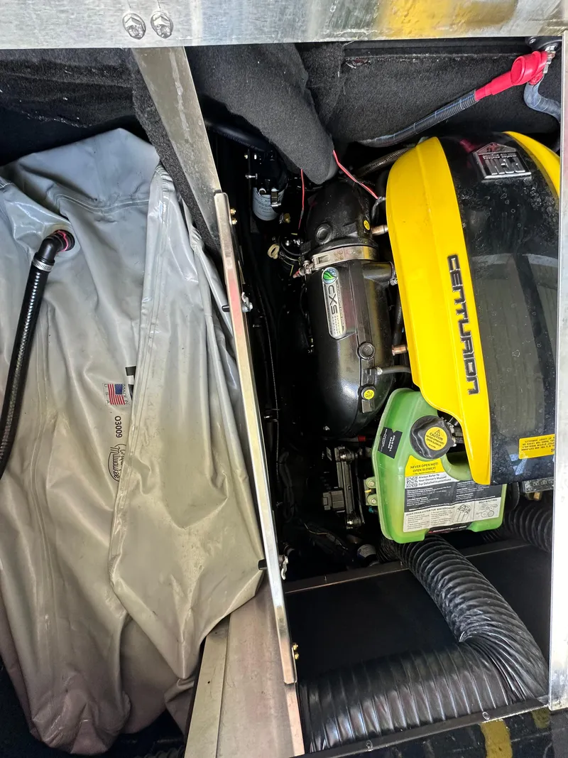 Slide: The Image of 2021 Centurion Ri245 engine compartment with yellow cover and visible components. - 43