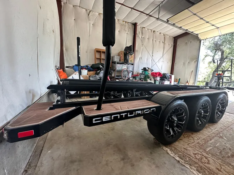 Slide: The Image of 2021 Centurion Ri245 boat trailer in a garage setting. - 46