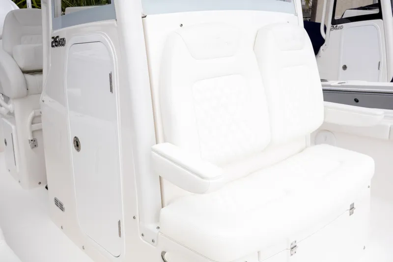 Slide: The Image of 2025 Regulator 26XO boat interior with white seating and storage compartment. - 15