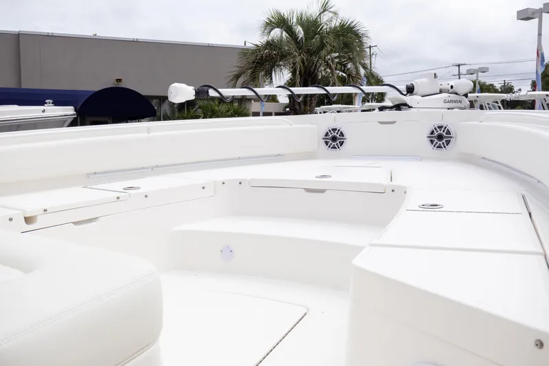Slide: The Image of 2025 Regulator 26XO boat interior with white seating and modern design. - 19
