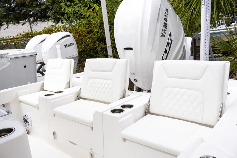 Slide: The Image of 2025 Regulator 26XO boat seats with Yamaha engines in the background. - 24