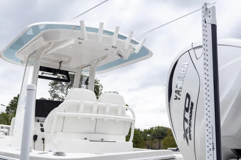 Slide: The Image of 2025 Regulator 26XO boat with Yamaha engine, featuring sleek design and modern seating. - 8