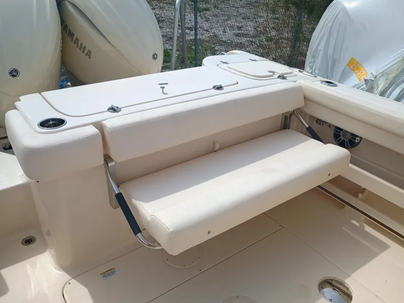 Slide: The Image of 2025 Grady-White Freedom 275 boat with foldable seating and Yamaha engines. - 10