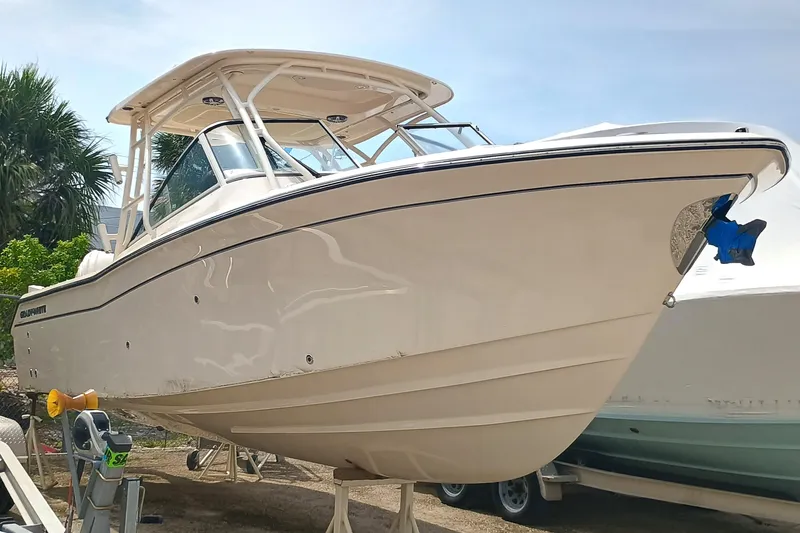 Slide: The Image of 2025 Grady-White Freedom 275 boat on display, side view. - 3