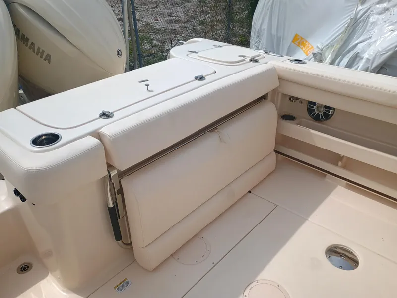 Slide: The Image of 2025 Grady-White Freedom 275 boat interior with seating and storage features. - 9
