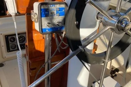Slide: The Image of Steering wheel and control panel on a 1992 Pacific Seacraft 37 Cutter sailboat. - 13