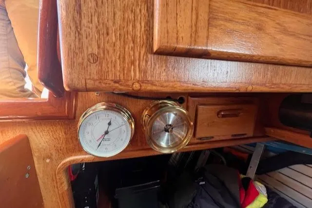 Slide: The Image of Interior of 1992 Pacific Seacraft 37 Cutter with wooden cabinetry and nautical instruments. - 20