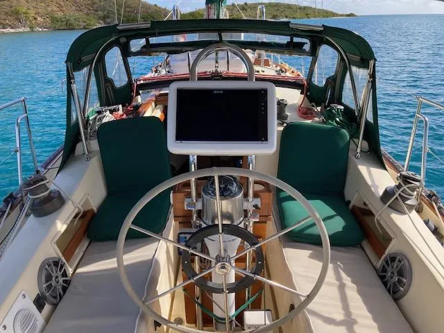 Slide: The Image of Cockpit of 1992 Pacific Seacraft 37 Cutter with steering wheel and navigation equipment. - 34