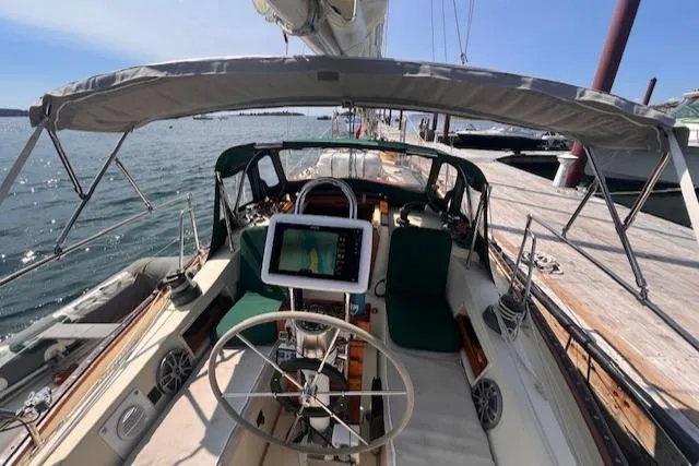 Slide: The Image of 1992 Pacific Seacraft 37 Cutter sailboat cockpit with steering wheel and navigation equipment. - 37