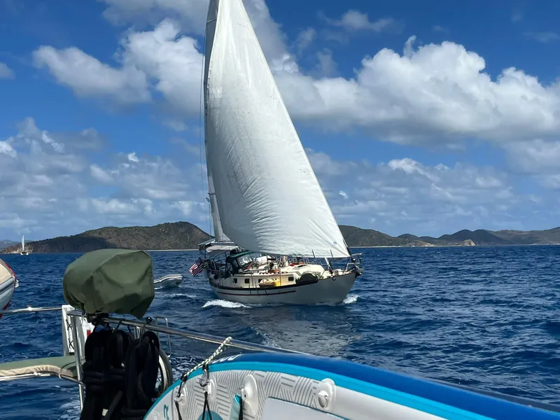 Slide: The Image of Sailing Pacific Seacraft 37 Cutter, 1992 model, on open sea with clear skies. - 45