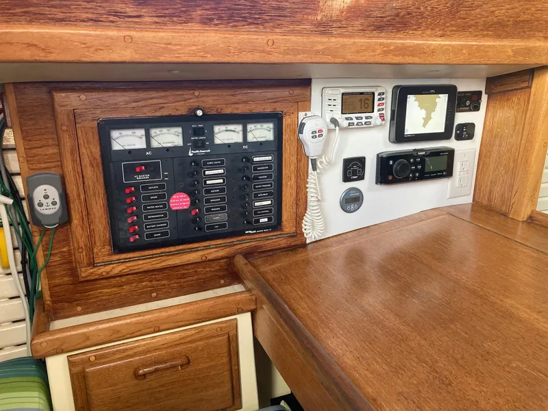 Slide: The Image of Navigation and control panel of a 1992 Pacific Seacraft 37 Cutter sailboat. - 12