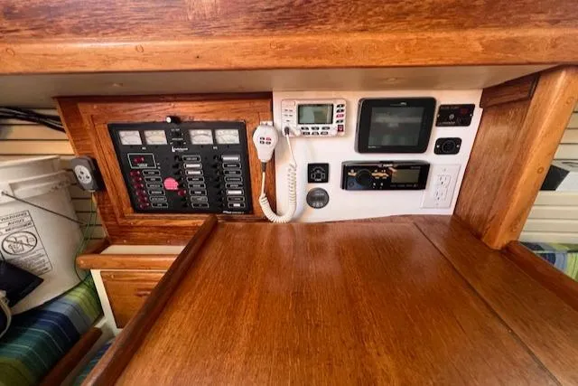 Slide: The Image of Navigation and control panel inside a 1992 Pacific Seacraft 37 Cutter sailboat. - 27