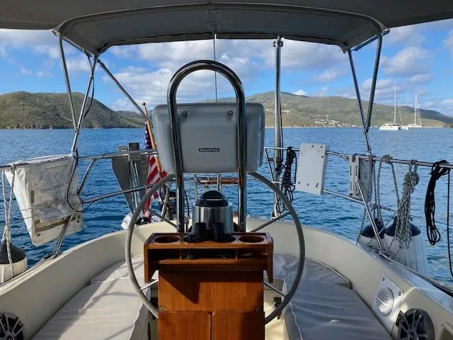 Slide: The Image of 1992 Pacific Seacraft 37 Cutter sailboat cockpit with scenic ocean view. - 33