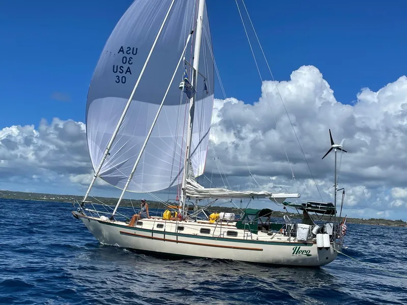 Slide: The Image of Sailing yacht Pacific Seacraft 37 Cutter, 1992 model, cruising on open water under clear skies. - 43