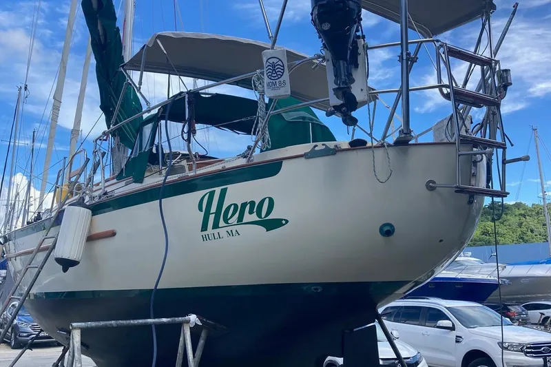 Slide: The Image of 1992 Pacific Seacraft 37 Cutter sailboat named "Hero" in a marina setting. - 48