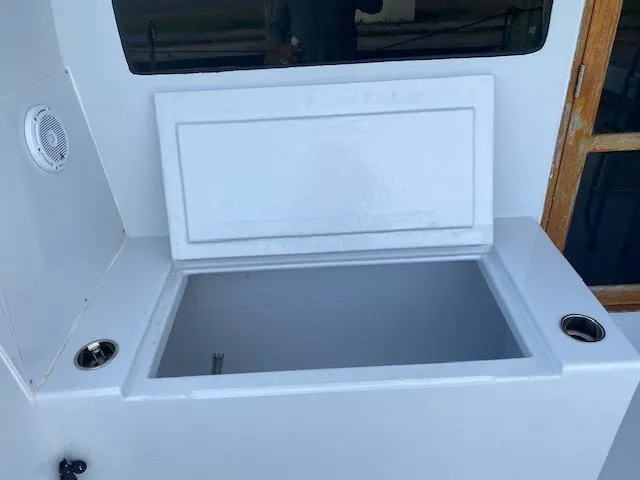 Slide: The Image of Open storage compartment on 1985 Bertram 38 Convertible boat deck. - 11