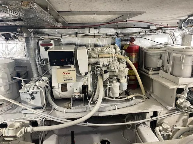 Slide: The Image of Engine room of 1985 Bertram 38 Convertible with Onan Marine GenSet. - 42