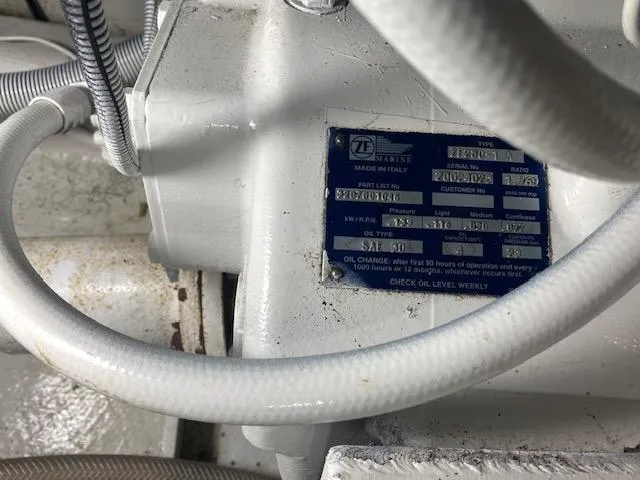 Slide: The Image of Engine compartment of 1985 Bertram 38 Convertible with visible identification plate. - 46