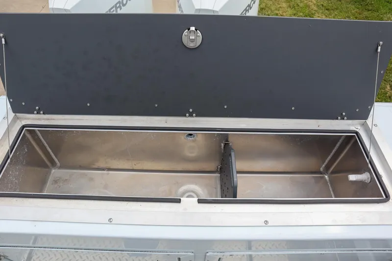 Slide: The Image of 2024 Hewescraft 270 Pacific Explorer livewell, open lid, stainless steel interior. - 6