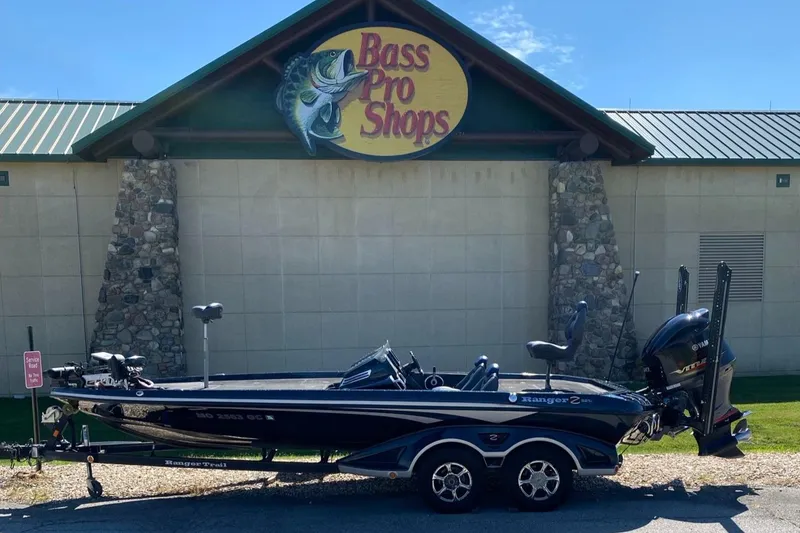 Slide: The Image of 2015 Ranger Z521C boat parked outside Bass Pro Shops. - 0