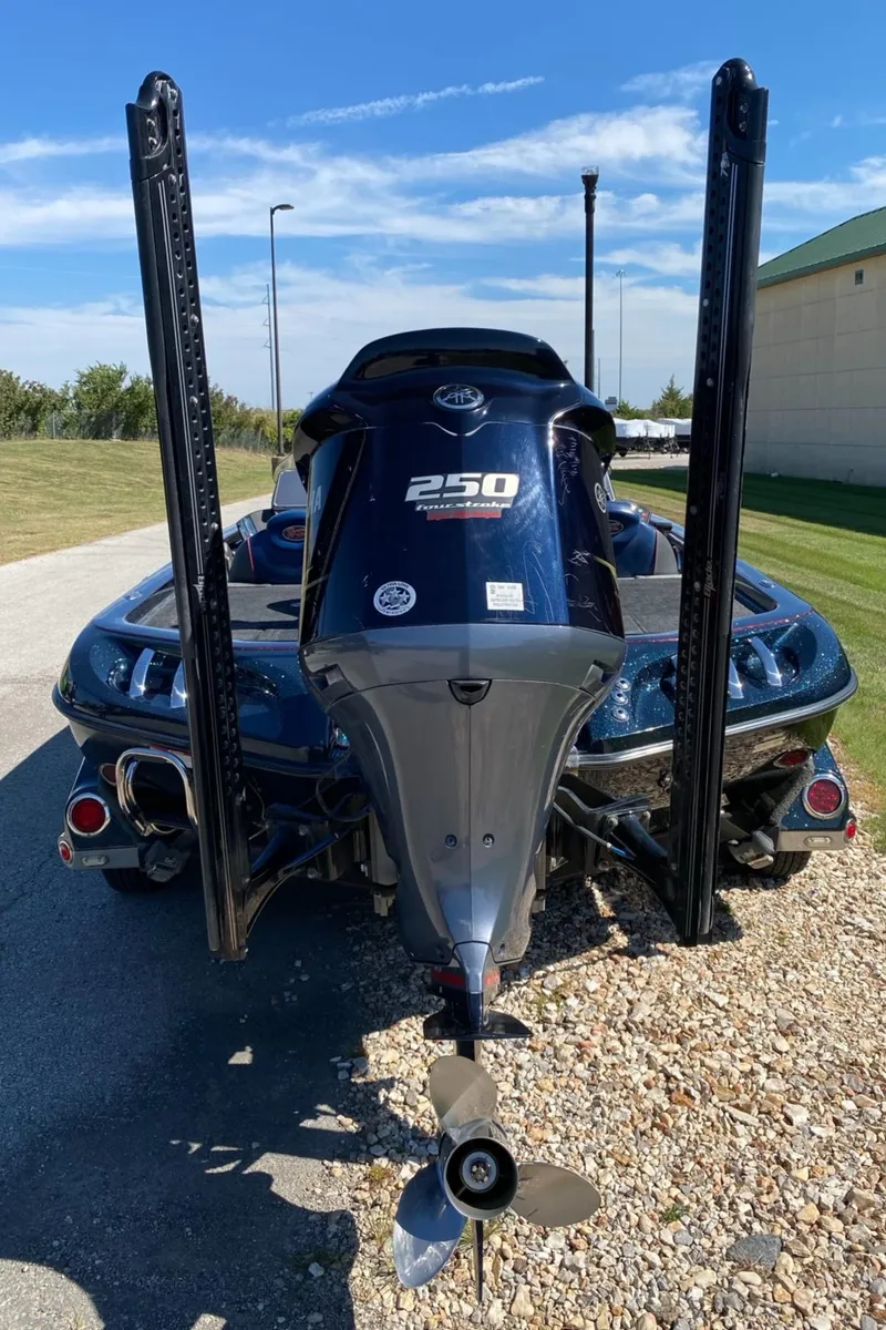 Slide: The Image of 2015 Ranger Z521C boat with Yamaha 250 engine, parked on gravel. - 2