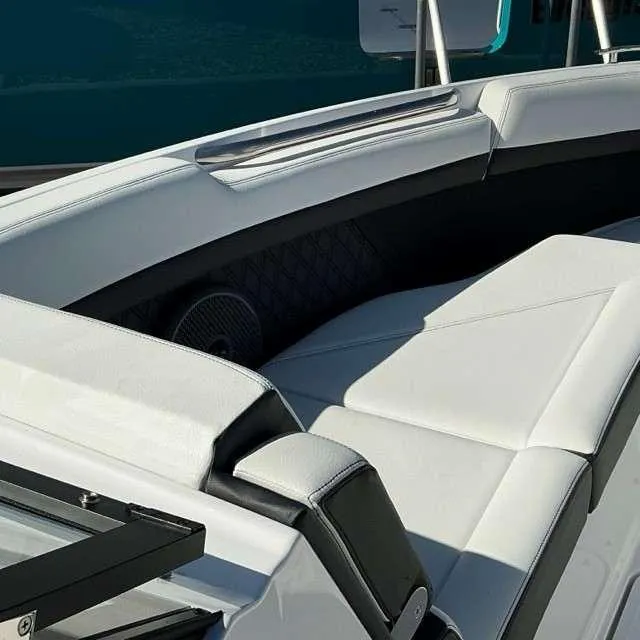 Slide: The Image of 2025 Cobalt R8 boat interior with sleek white seating and modern design. - 11