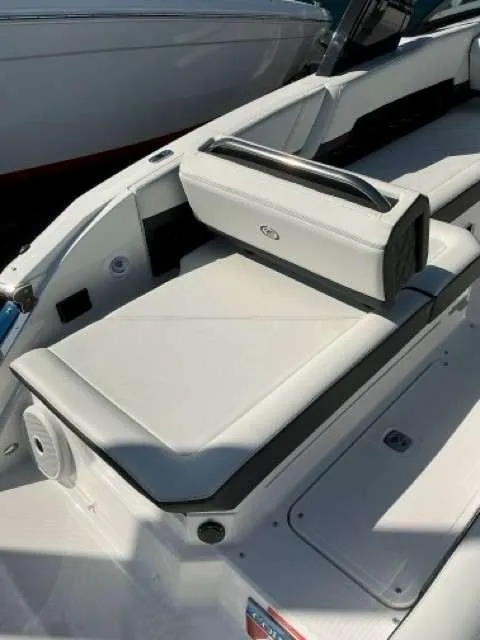 Slide: The Image of 2025 Cobalt R8 boat interior with white seating and sleek design. - 12