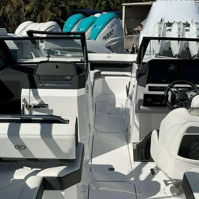 Slide: The Image of 2025 Cobalt R8 boat interior with modern dashboard and seating. - 16