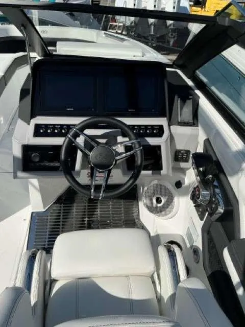 Slide: The Image of 2025 Cobalt R8 boat cockpit with modern steering and control panels. - 4