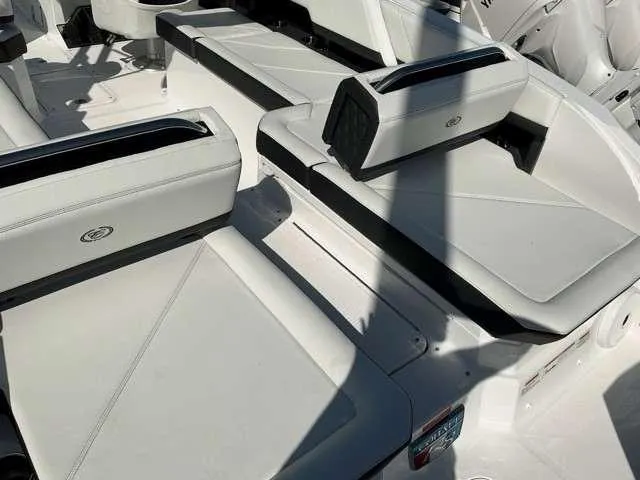 Slide: The Image of 2025 Cobalt R8 boat interior with white leather seating and sleek design. - 8