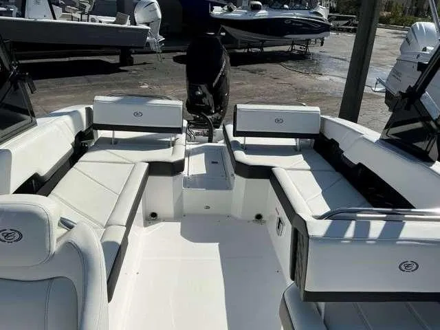 Slide: The Image of 2025 Cobalt R8 boat interior with white seating and modern design. - 9