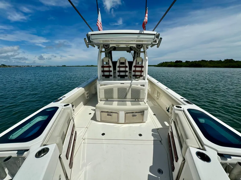 Slide: The Image of 2020 Solace 345 boat on calm water under a clear blue sky. - 22