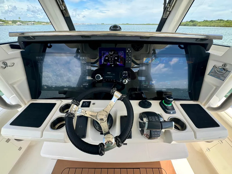 Slide: The Image of 2020 Solace 345 boat dashboard with advanced navigation controls and dual screens. - 40