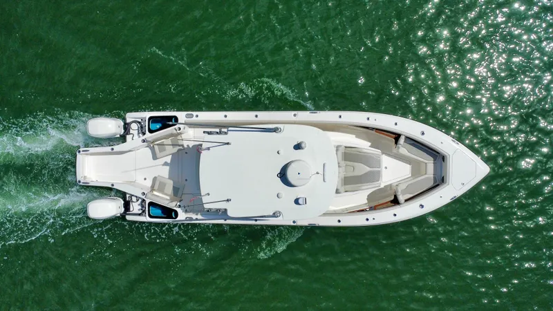 Slide: The Image of Aerial view of 2020 Solace 345 boat cruising on green water. - 8