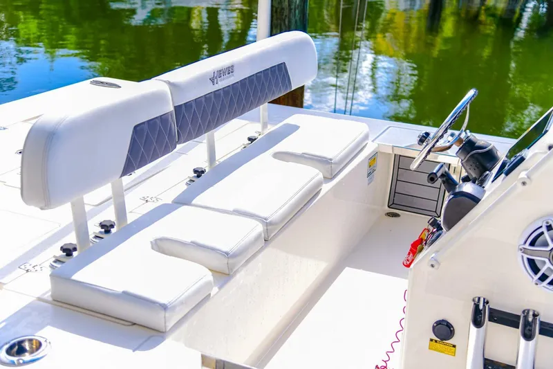 Slide: The Image of 2022 Hewes Redfisher 21 boat interior with seating and steering console. - 18
