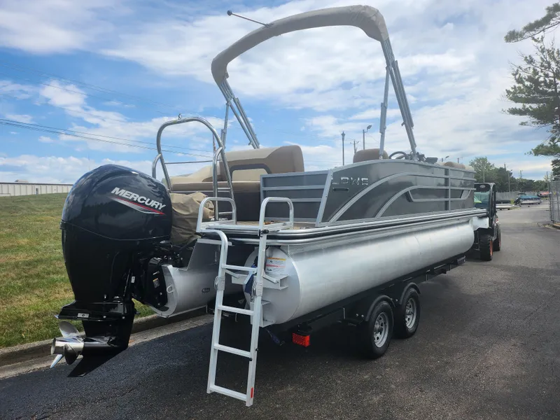Slide: The Image of 2022 Lowe SS 210 CL pontoon boat with Mercury outboard motor on trailer. - 3